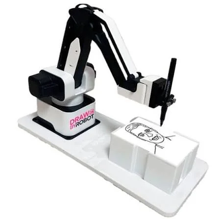 White and black robotic arm drawing a line portrait on a drawing station